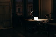 Silver Macbook on Brown Wooden Table