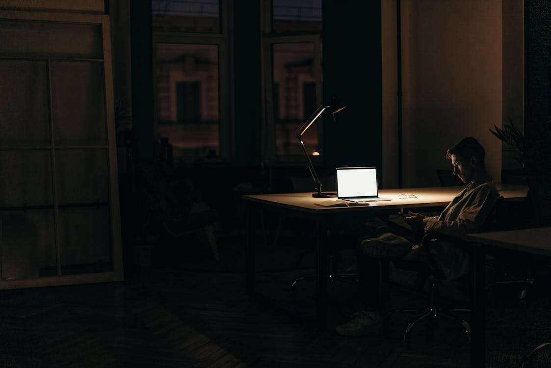 Silver Macbook on Brown Wooden Table