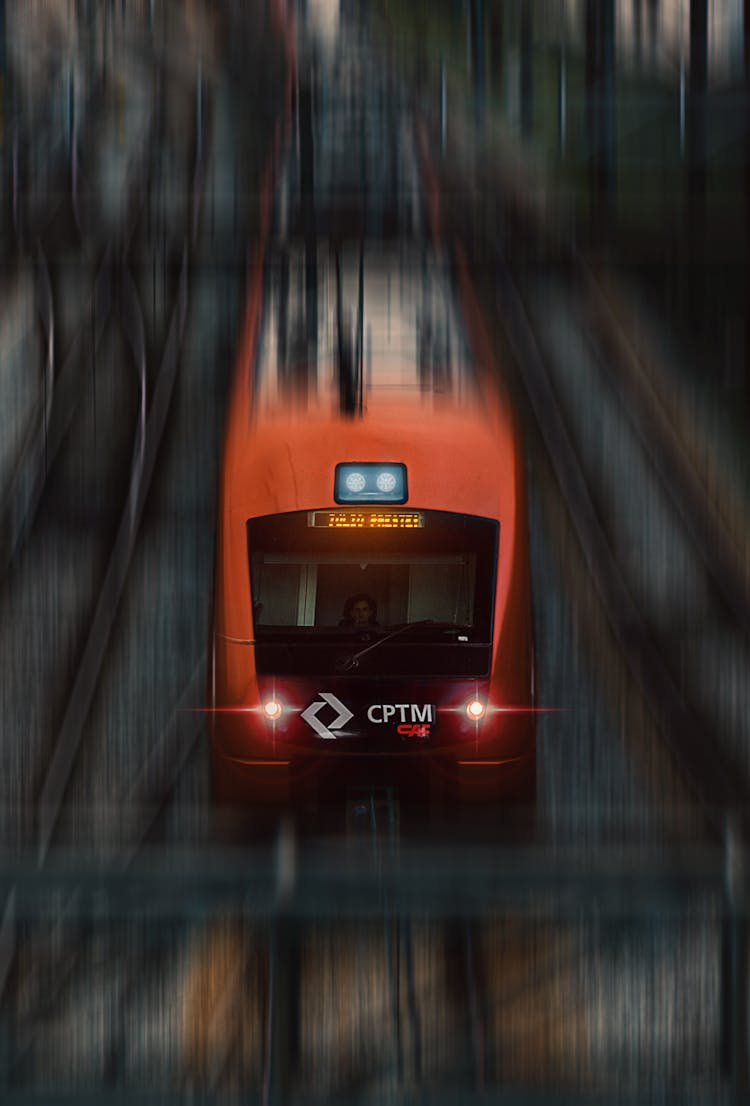 Modern Train Driving Fast On Railroad