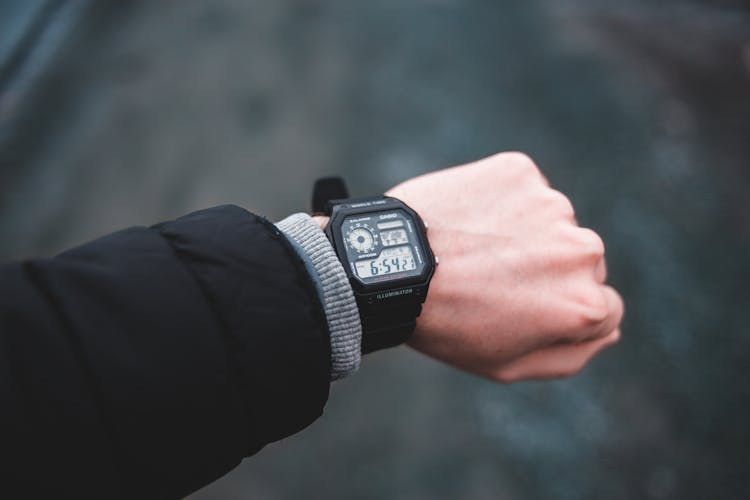 Person Wearing Black Digital Watch