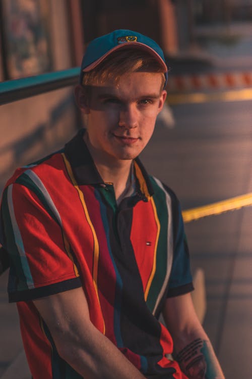 Man in Colorful Striped Polo Shirt