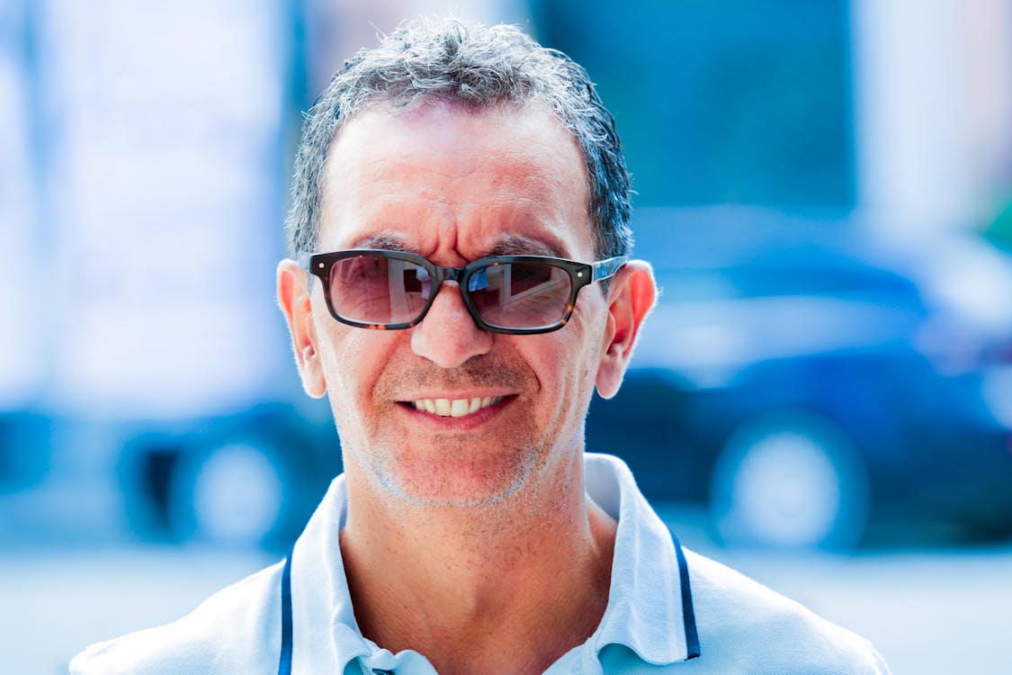 Man in White Collared Shirt Wearing Black Framed Eyeglasses