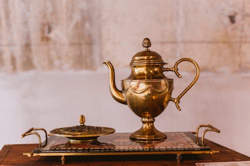 Free Gold Teapot on Black and White Tray Stock Photo