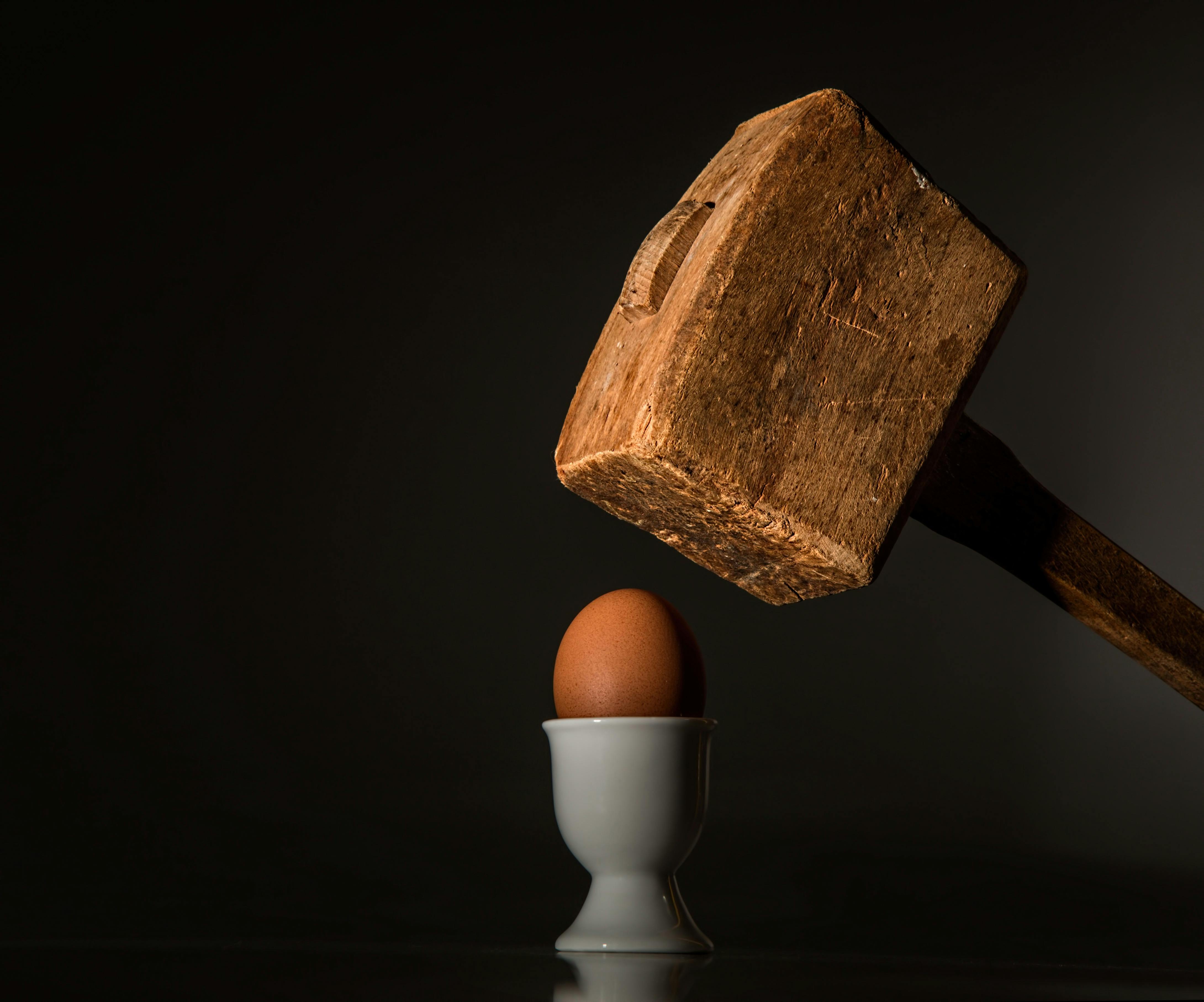 brown wooden mallet near brown chicken egg