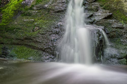 Waterfalls on Green Mossy Rock