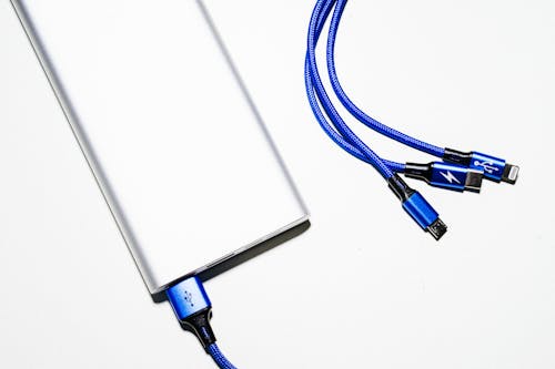 Free White Power Bank and Blue Coated Wires Stock Photo
