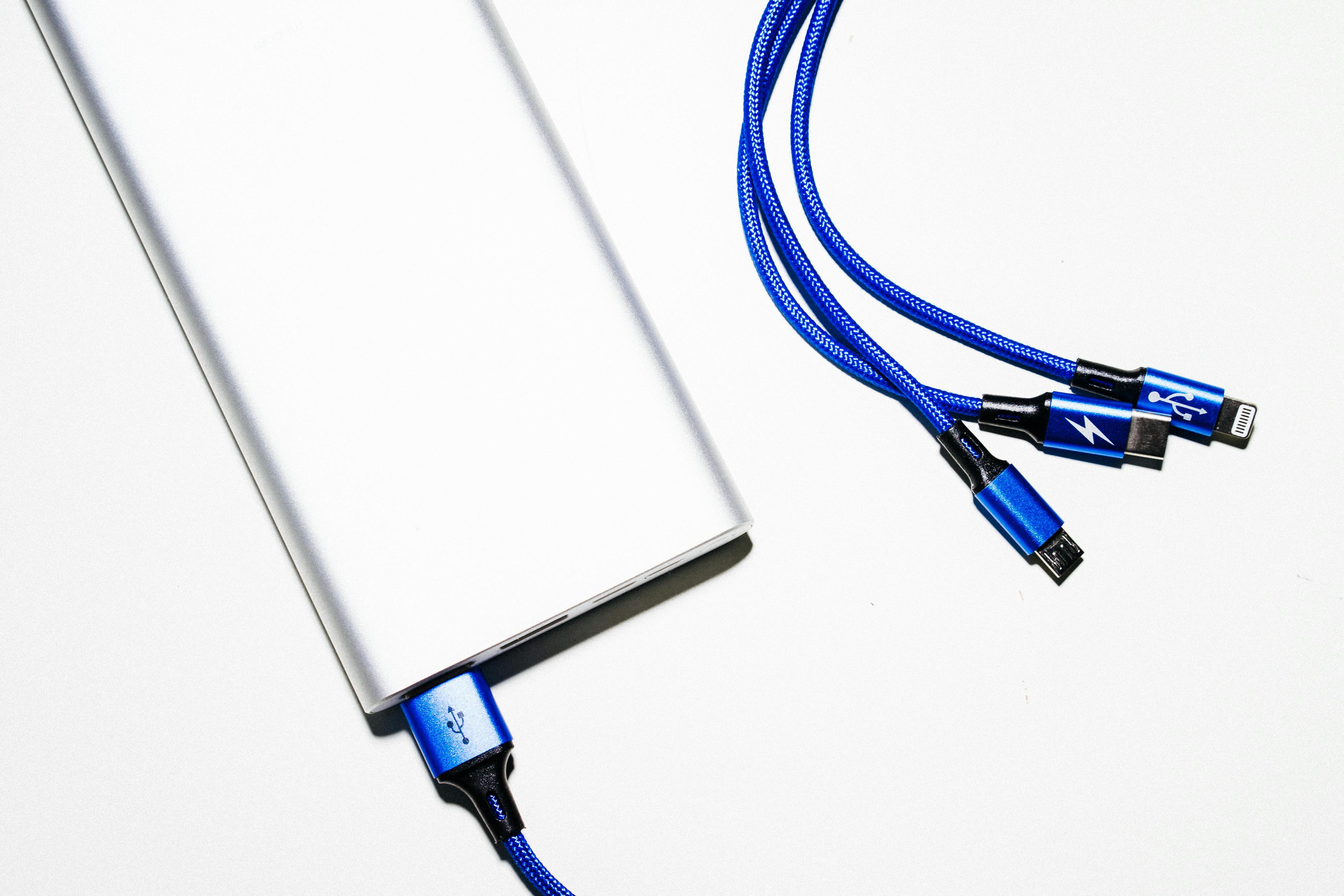 White Power Bank and Blue Coated Wires \u00b7 Free Stock Photo
