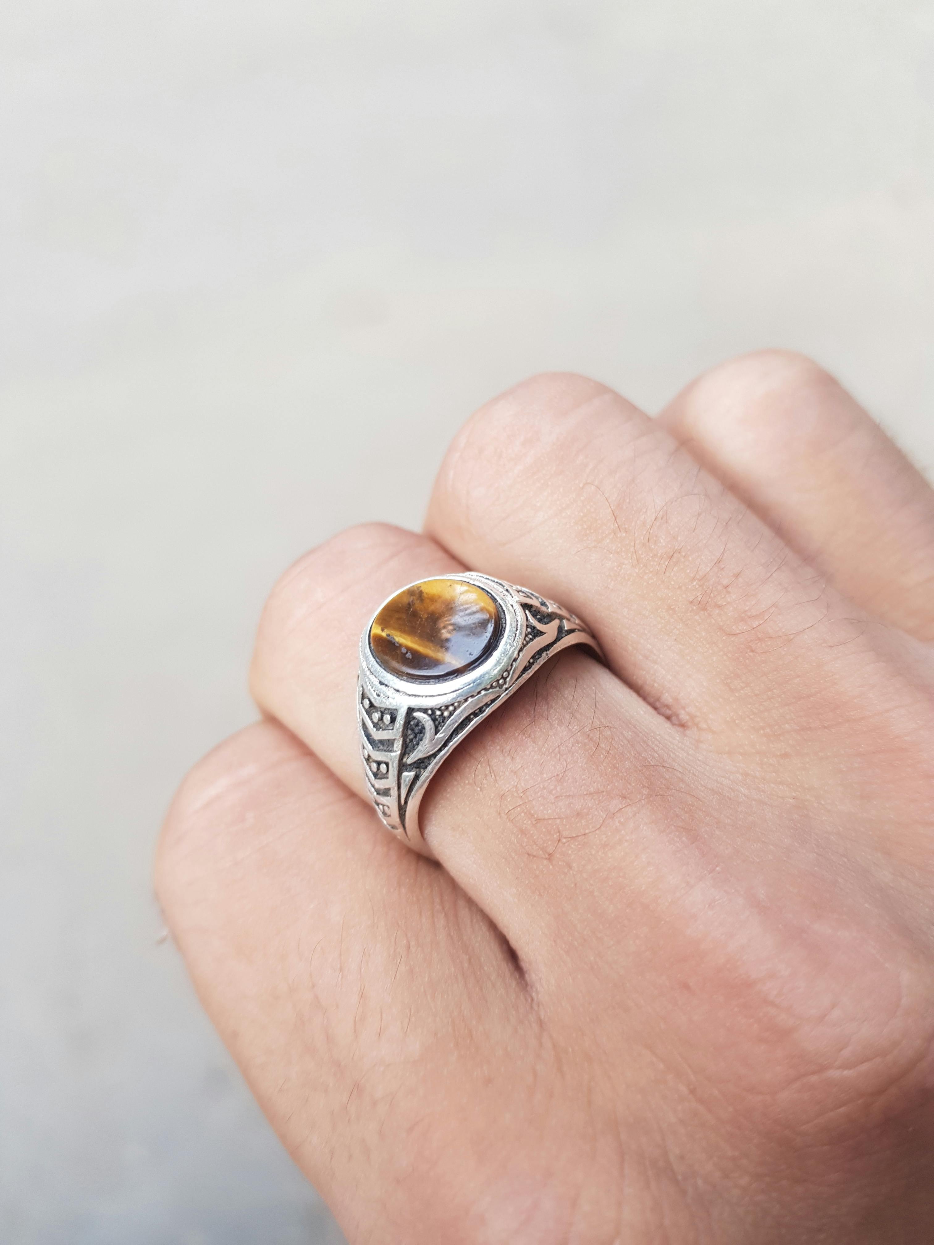unrecognizable person with handmade silver ring