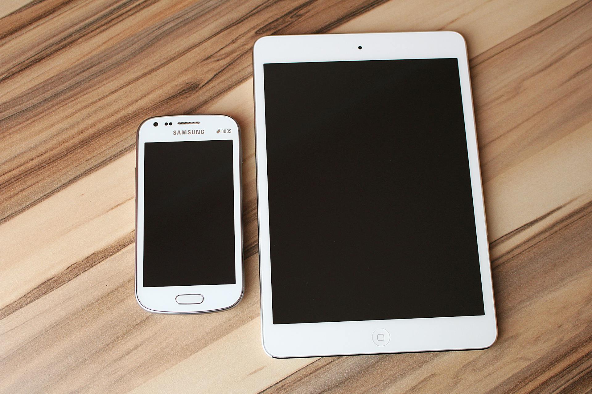 White Ipad and Samsung Smartphone