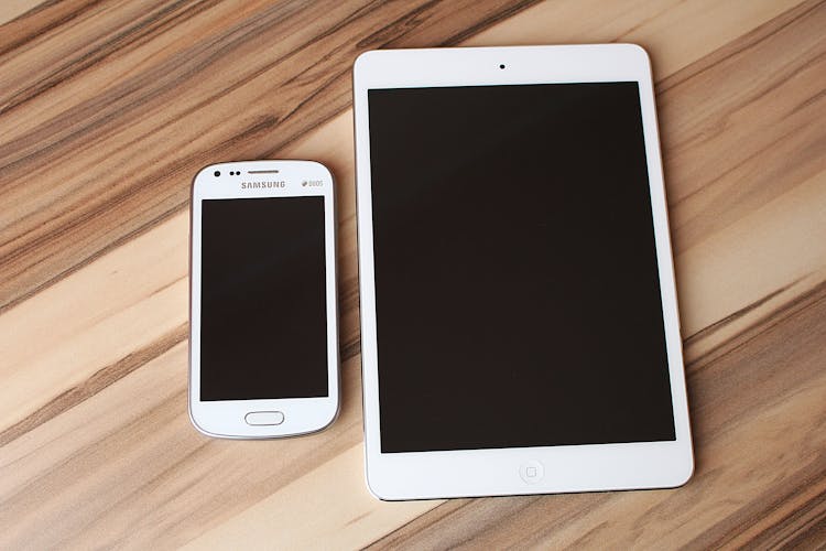 White Ipad And Samsung Smartphone