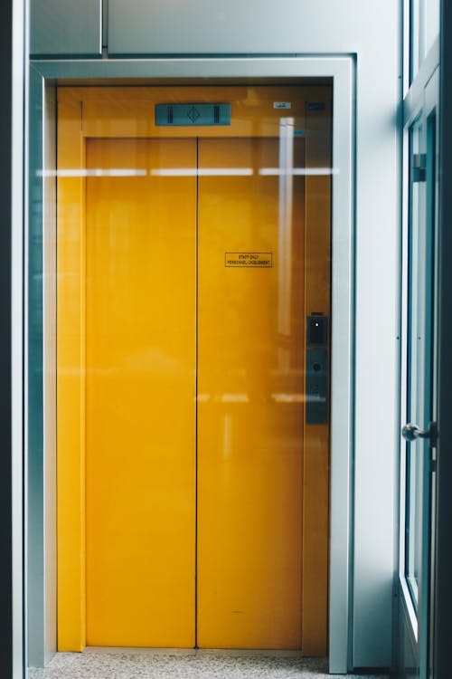 Free Closed Yellow Elevator Door Stock Photo