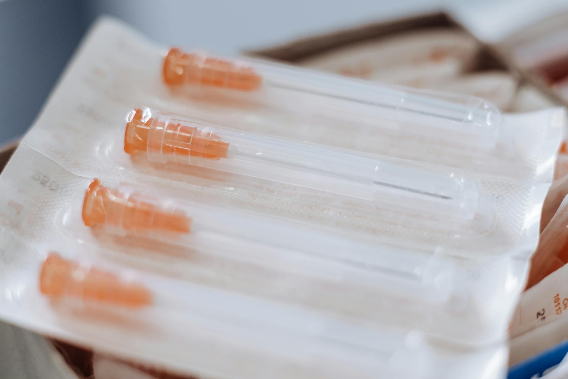 Close-up of sterile syringes in packaging, ideal for healthcare and medical use.