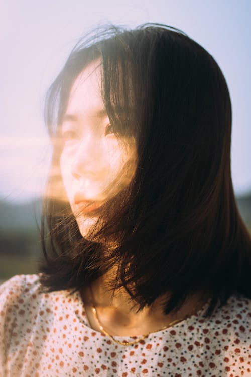 Woman in White and Red Floral Shirt