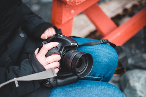 Person Holding Black Nikon Dslr Camera