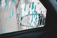 Foamy smudges on surface of window