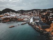Port city surrounded by sea and mountains