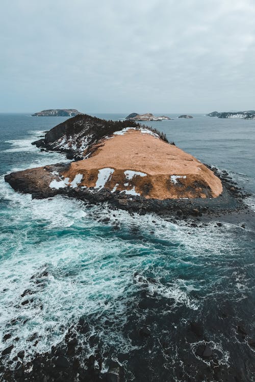 Brown Rock Formation on Sea