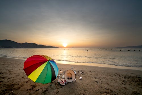 People on Beach During Sunset