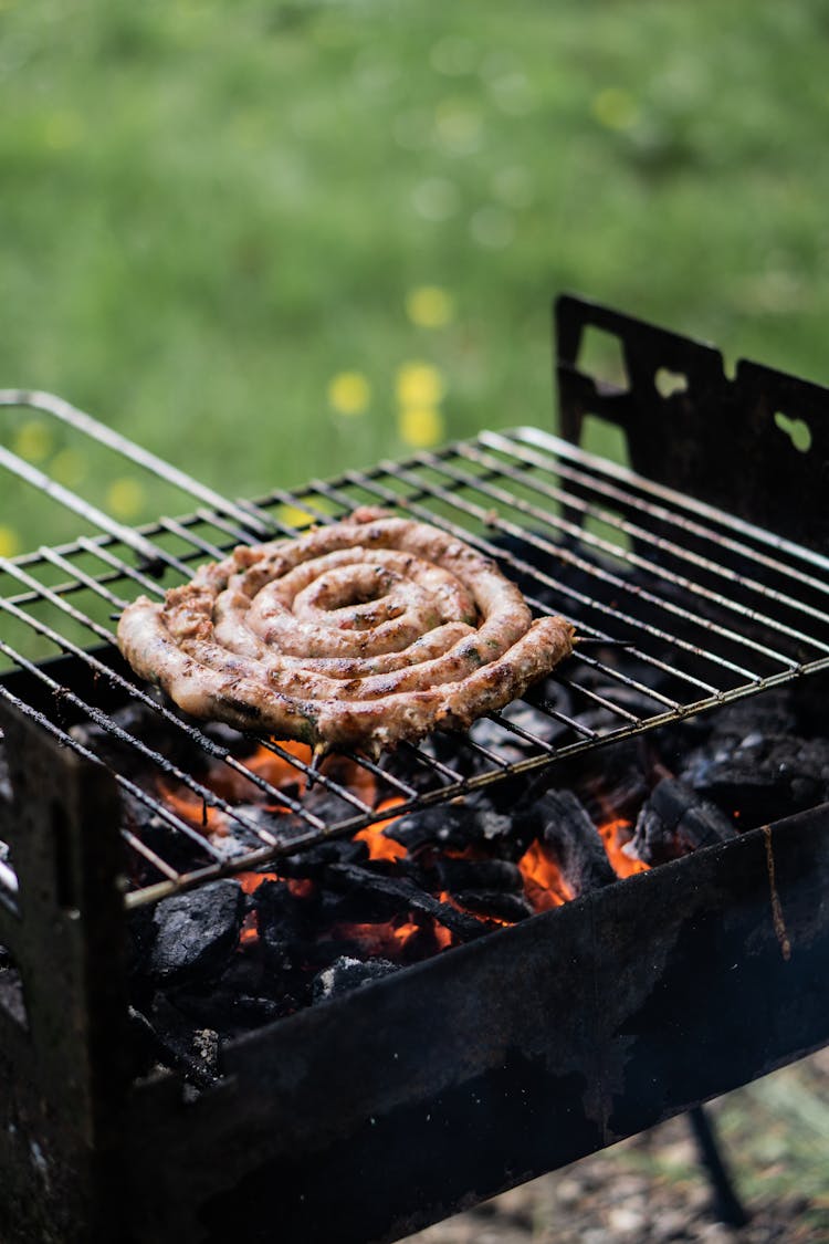 Brown Sausage On Black Metal Grill