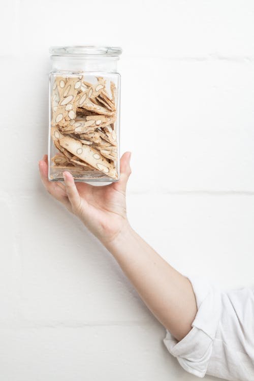 Free Person Holding Glass Cookie Jar Stock Photo