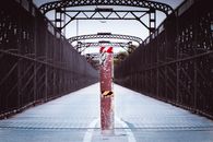 Shabby dividing post in middle of pedestrian bridge