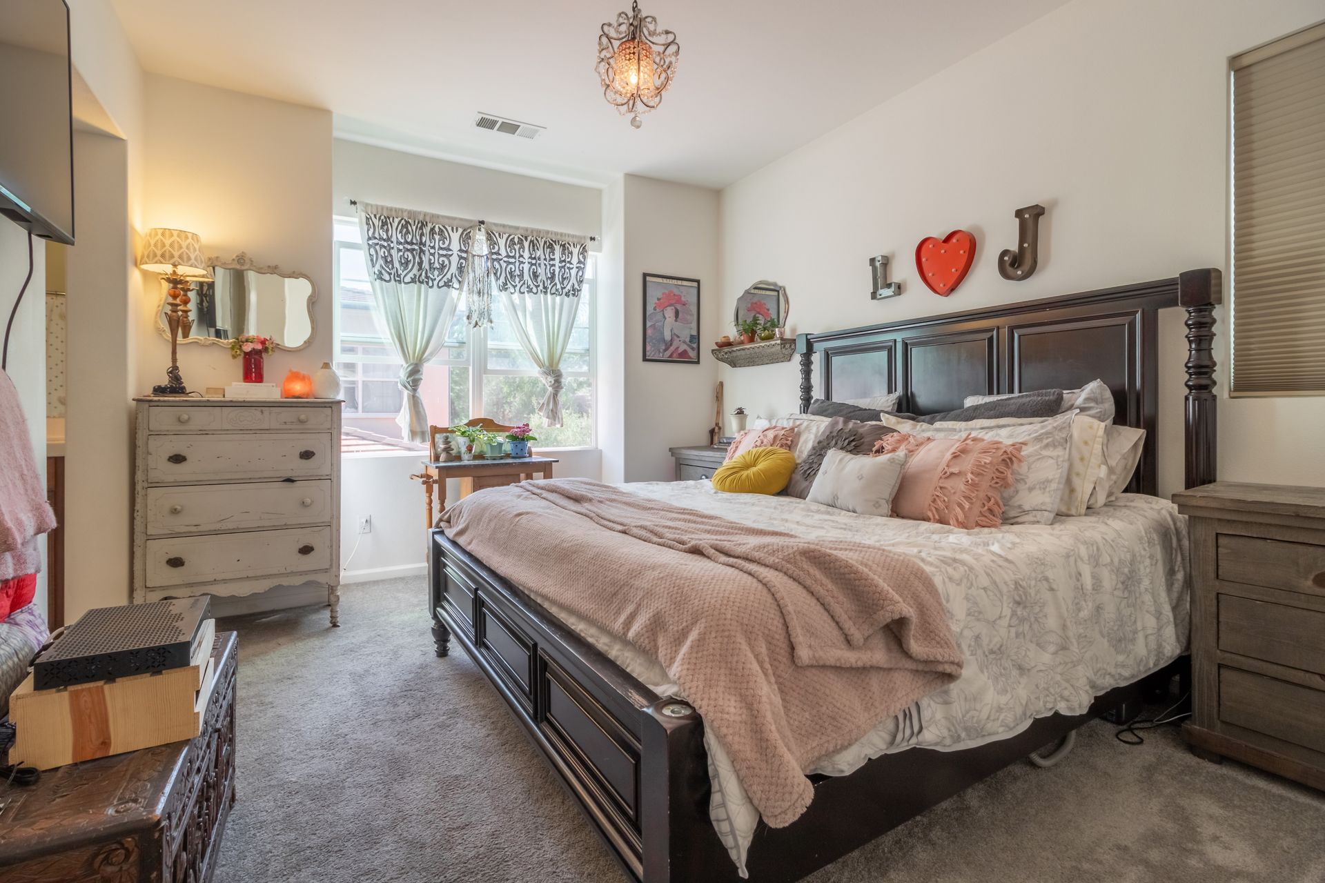 Stylish bedroom interior with a comfortable bed and decorative accents.