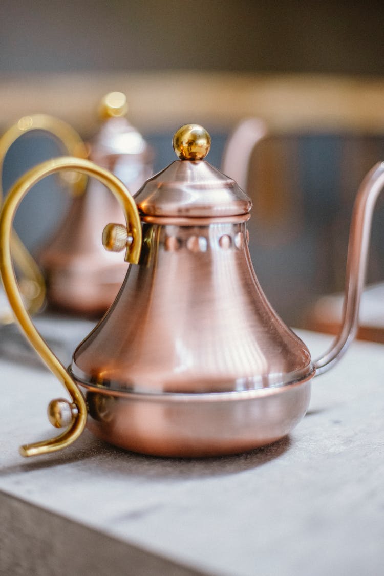 Rose Gold With Gold Handle Teapot On Table