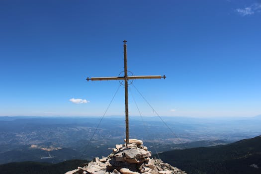 Stunning view of a cross on a mountain peak overlooking Blagoevgrad, Bulgaria.