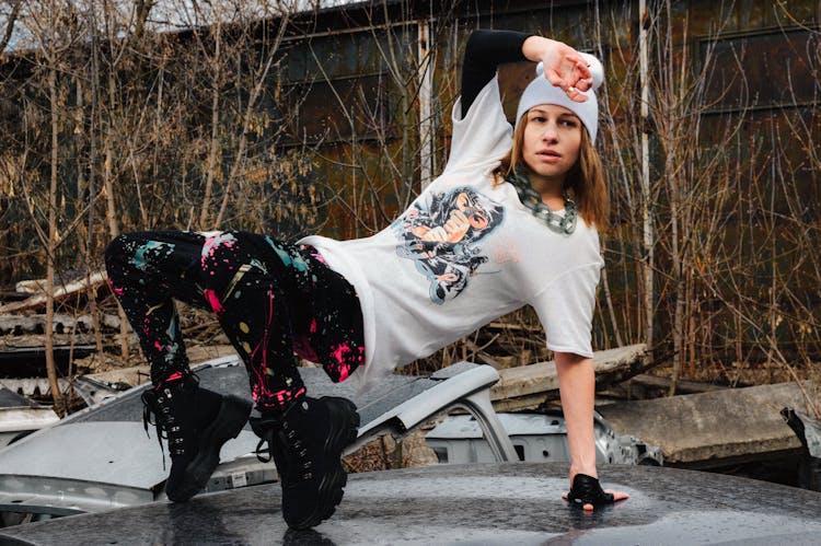 Confident Young Hip Hop Dancer Performing In Abandoned Yard