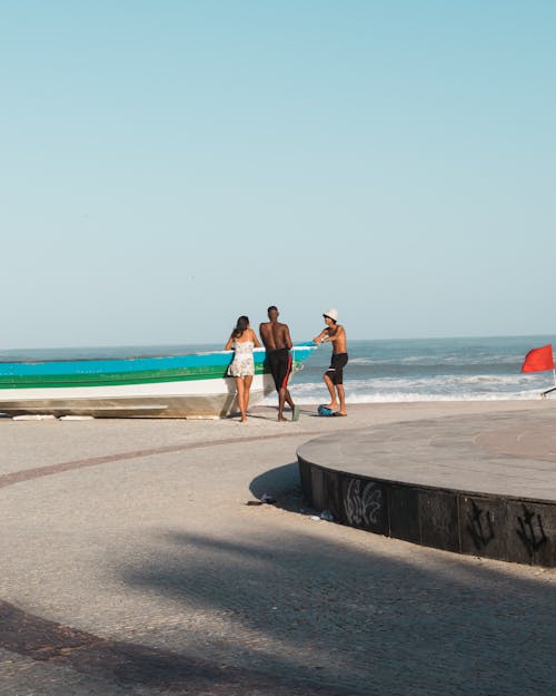 People Standing on Beach Shore