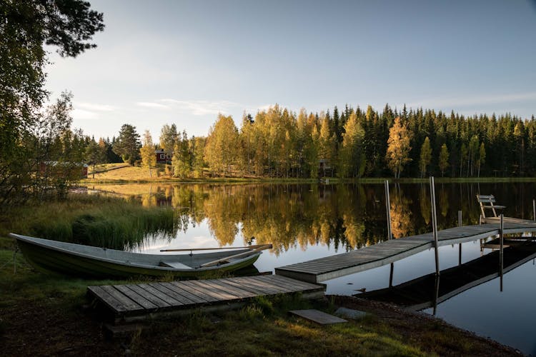 White Boat On Lake Dock