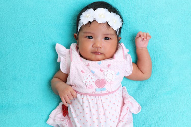 Top View Of Baby Girl In Pink Cloths