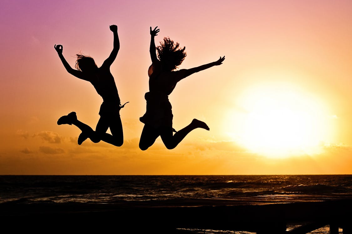 Free Silhouette Photography Of Jump Shot Of Two Persons Stock Photo