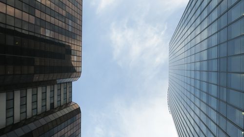 Free Low-angle view of modern skyscrapers in Lyon, France against a blue sky. Stock Photo