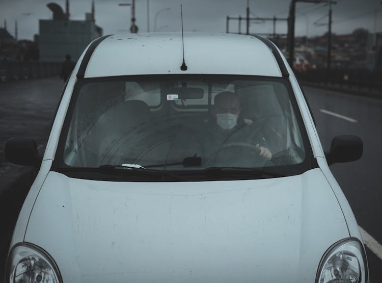 Anonymous Driver In Car On City Street