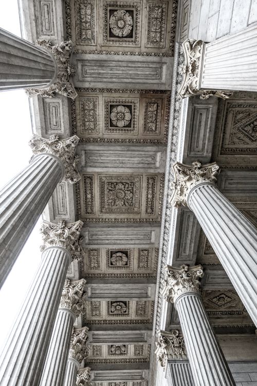 Free Intricate view of ornate Roman columns and ceiling details in Lyon, France. Stock Photo