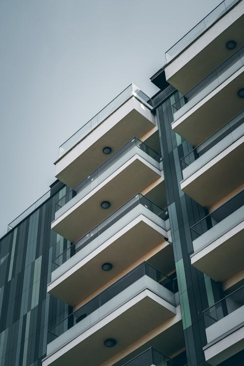 Stylish geometric building with glass balconies