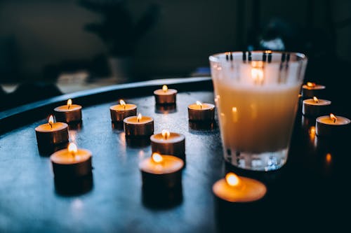 Clear Glass With Candle on Table