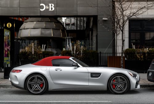 Silver Mercedes Benz Parked Near Brown Building