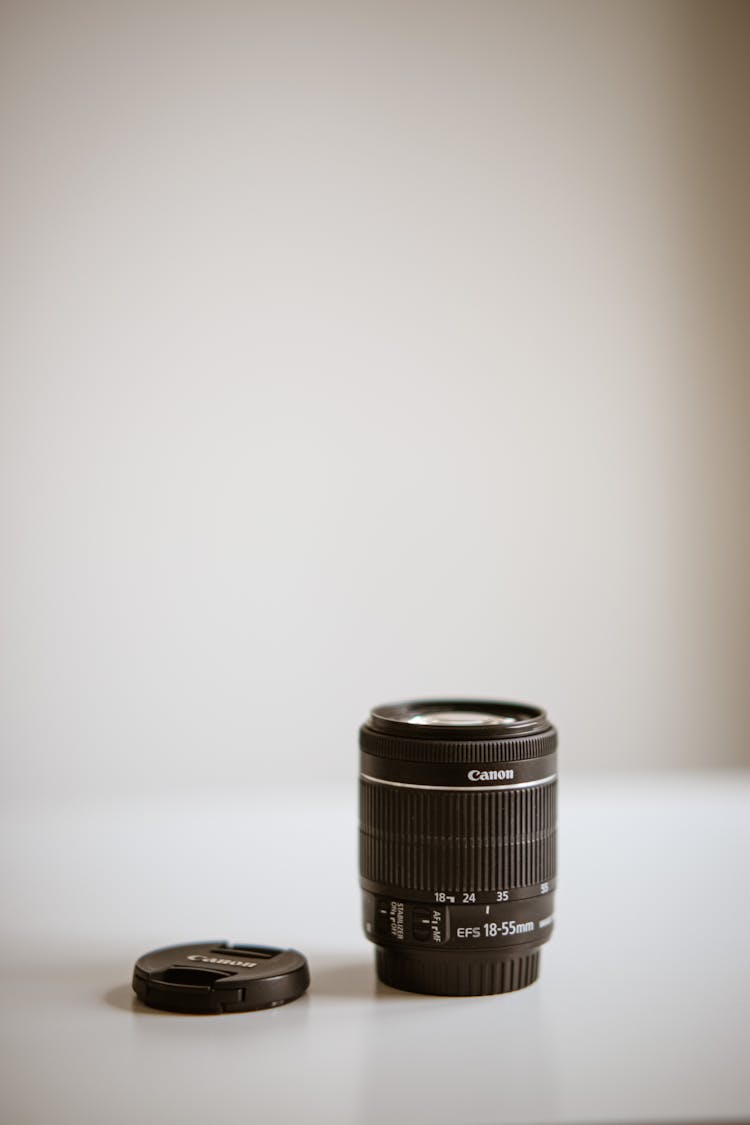 Black Camera Lens On White Surface