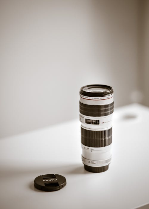 Black and White Camera Lens on White Table