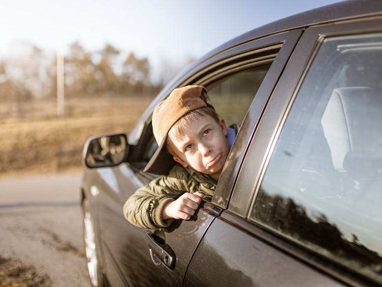 Kid's Head On Car Window