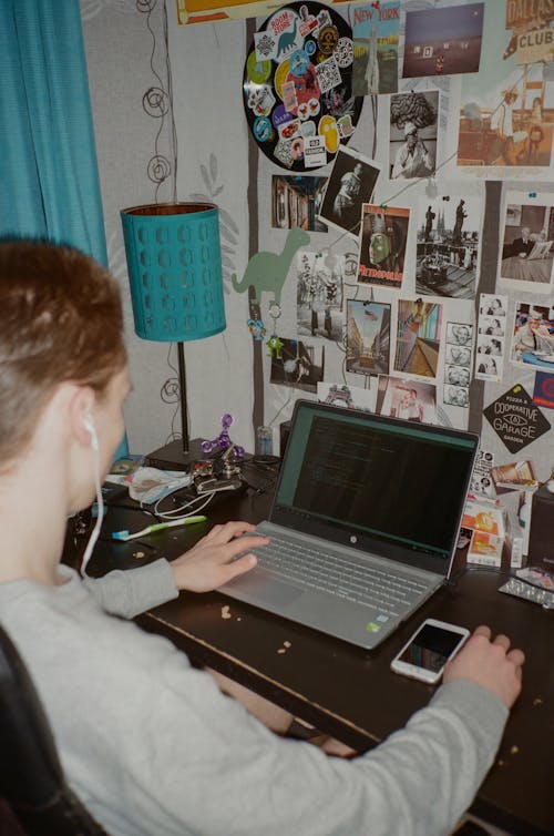 Man in Gray Jacket Using Laptop Computer