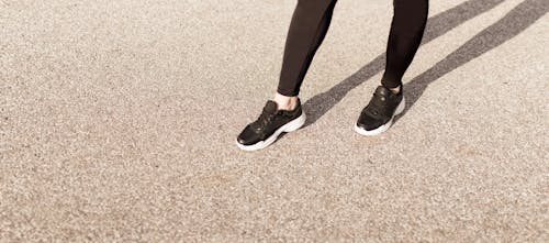 Free Person in Black Pants and Black and White Sneakers Stock Photo