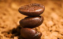 Stacked roasted coffee beans — photo by Jacob Yavin on Pexels
