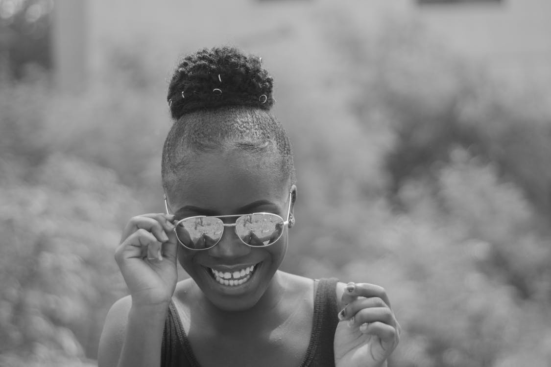 Grayscale Photo of Woman Wearing Sunglasses