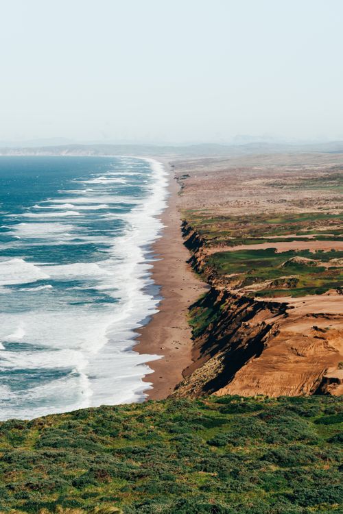 Free Explore the stunning cliffs and waves of Point Reyes Coast, capturing the essence of California's natural beauty. Stock Photo