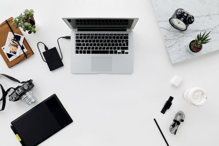 Gray And Black Laptop On White Table