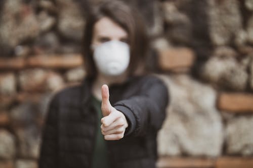 Woman in Black Jacket Doing Thumbs Up Hand Sign