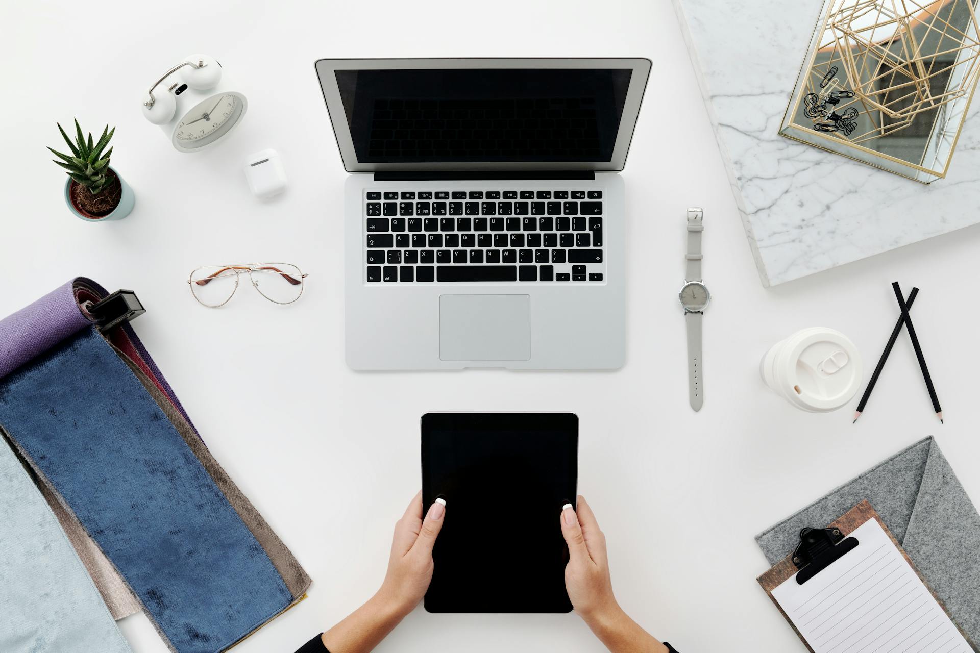 Person Holding Black Tablet Computer